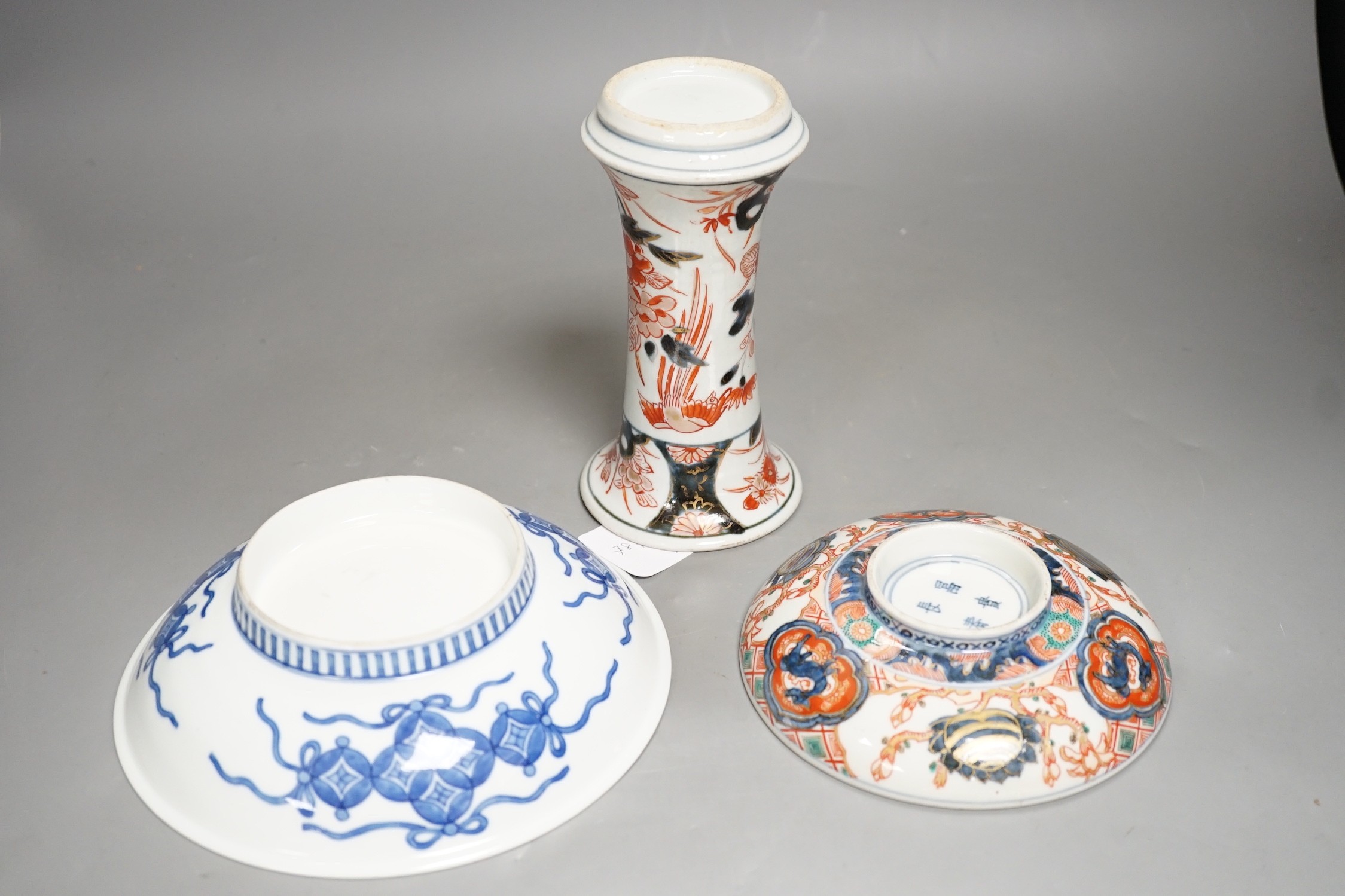 An 18th century Japanese Arita porcelain vase, a Nabeshima style dish and an Arita dish, height of vase 17cm